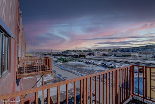 view of balcony at dusk