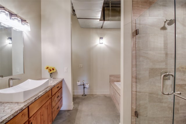 bathroom featuring vanity and plus walk in shower