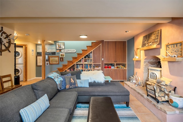 living room featuring stacked washing maching and dryer