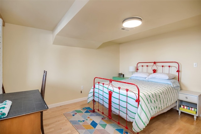 bedroom with light hardwood / wood-style floors