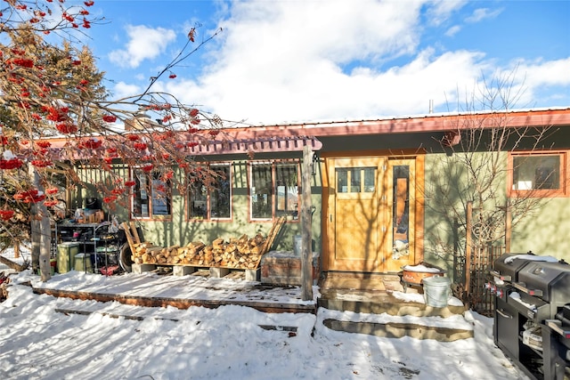 view of snow covered house