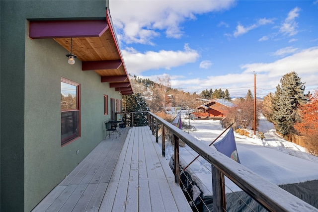 view of snow covered deck