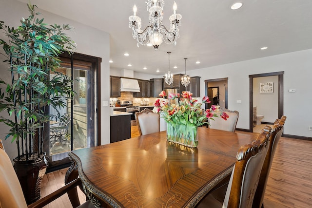 dining room featuring a chandelier and light hardwood / wood-style floors