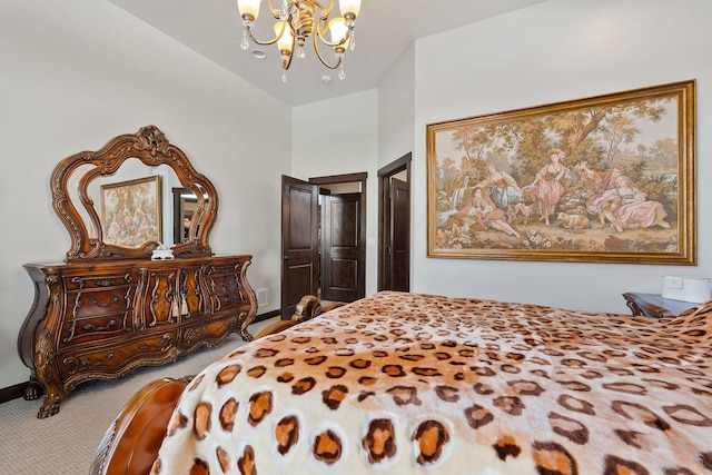 carpeted bedroom with an inviting chandelier