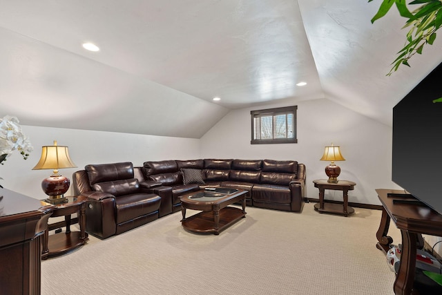 carpeted living room with lofted ceiling