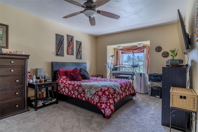 bedroom with light carpet and ceiling fan