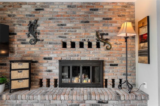 room details featuring a brick fireplace