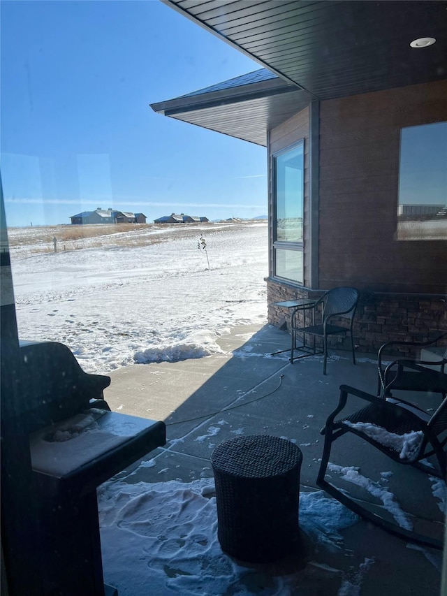 view of snow covered patio