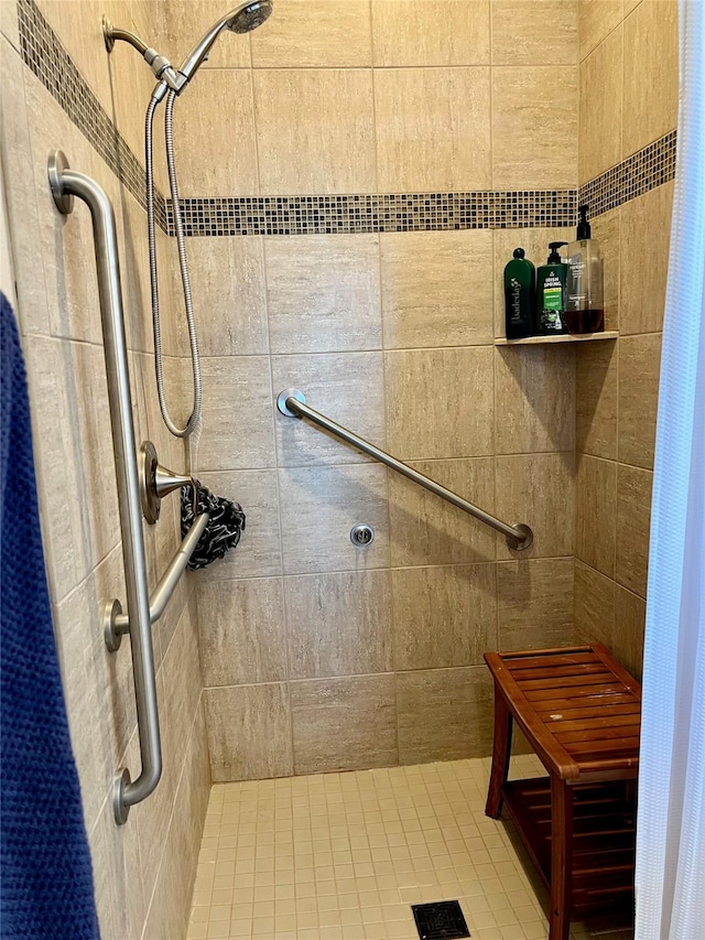 bathroom with a tile shower