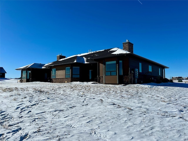 view of snow covered house