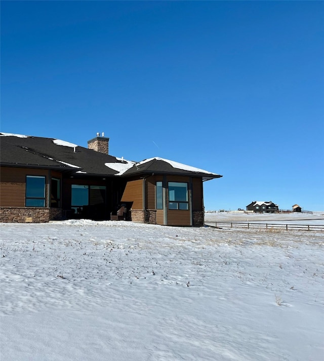 view of snow covered property