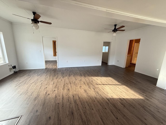 spare room with a healthy amount of sunlight, dark hardwood / wood-style floors, and crown molding