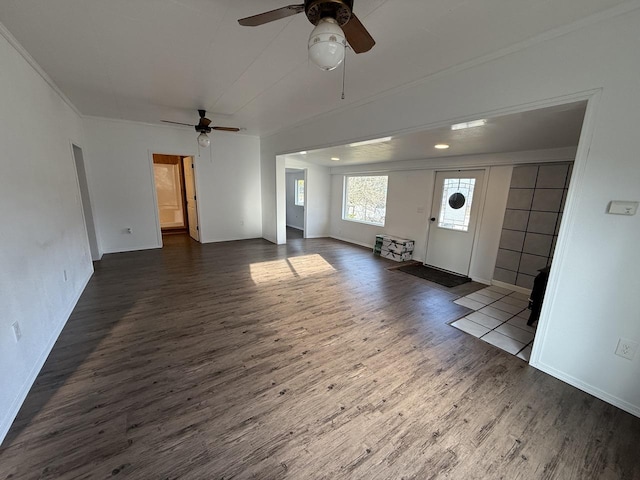 interior space with ceiling fan and dark wood-type flooring