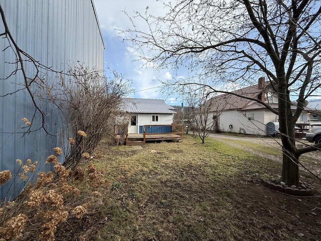 view of yard with a wooden deck