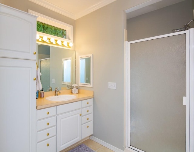 bathroom with tile patterned floors, walk in shower, ornamental molding, and vanity