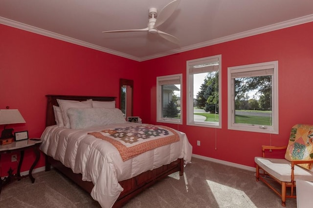 carpeted bedroom featuring ceiling fan and crown molding