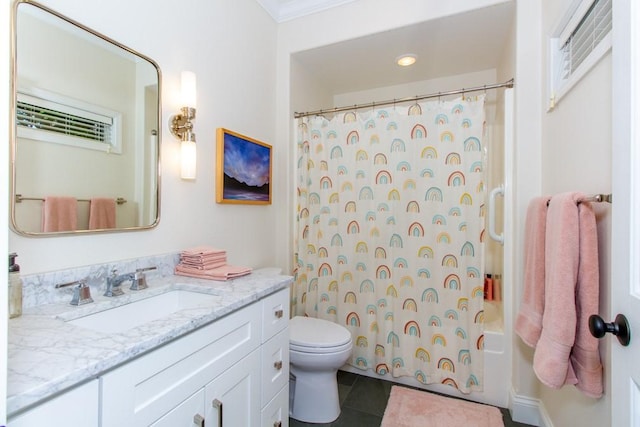 full bathroom featuring toilet, vanity, tile patterned flooring, and shower / bath combo with shower curtain