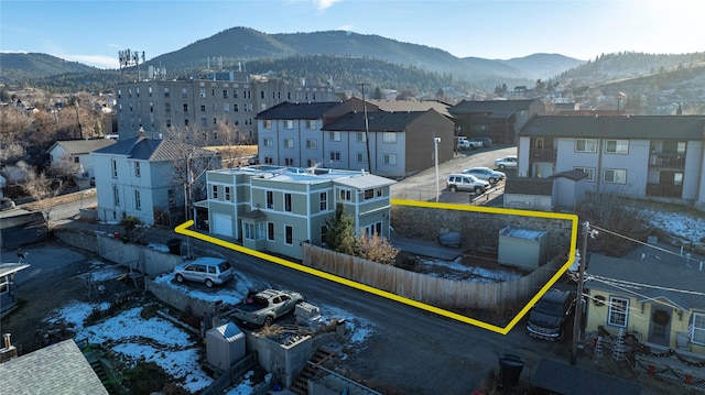 birds eye view of property with a mountain view