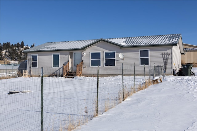 view of snow covered house