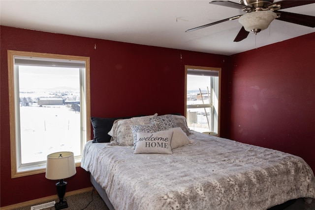 bedroom featuring ceiling fan and carpet floors