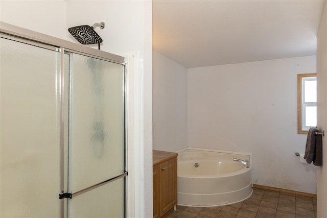 bathroom with tile patterned flooring, separate shower and tub, and vanity