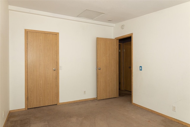 unfurnished room with light colored carpet