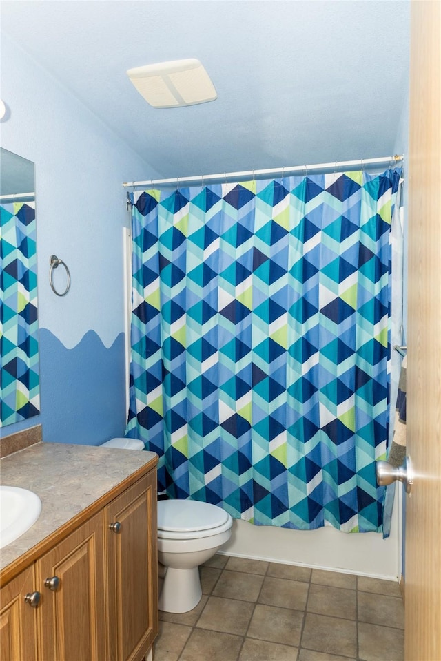 full bathroom featuring toilet, vanity, and shower / bath combination with curtain