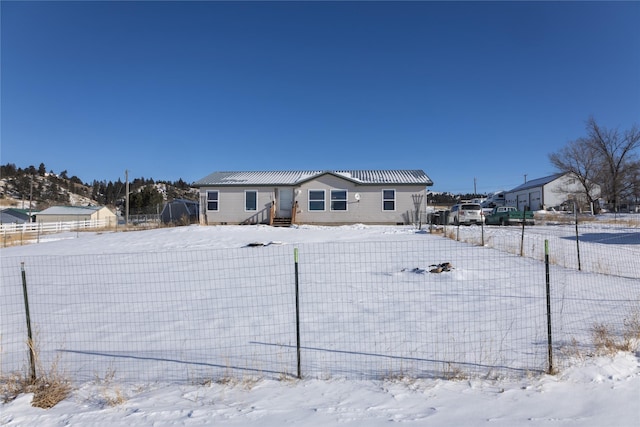 view of snow covered property