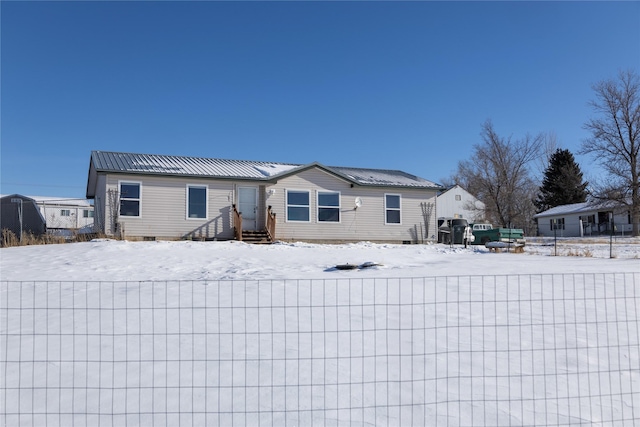 view of snow covered property