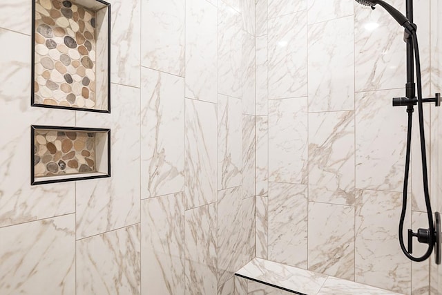 full bathroom featuring tiled shower