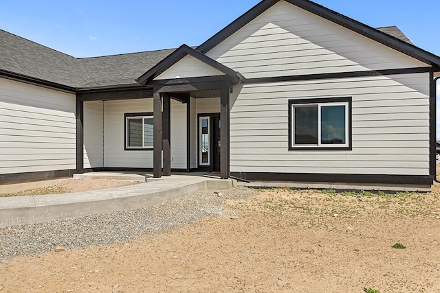 view of front of home featuring a shingled roof