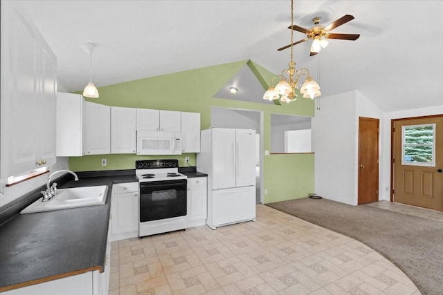 kitchen with lofted ceiling, white cabinets, hanging light fixtures, and white appliances