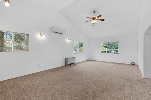 unfurnished living room with carpet, high vaulted ceiling, ceiling fan, and a wall unit AC