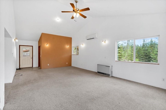 unfurnished living room featuring light carpet, a wall unit AC, ceiling fan, heating unit, and high vaulted ceiling