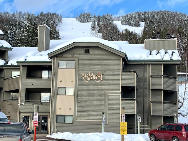 view of snow covered property