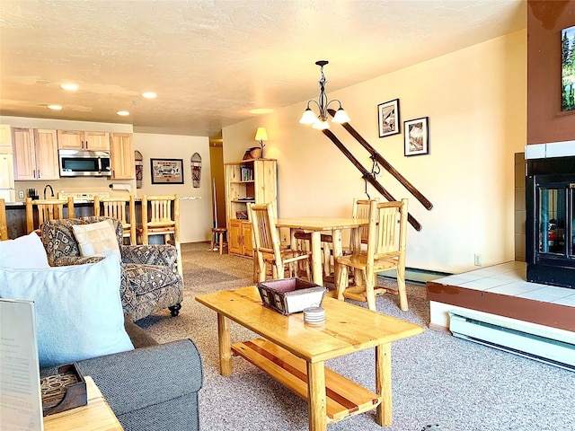 3898 Big Mountain Rd Unit 202, Whitefish, MT 59937 - living area featuring recessed lighting, light carpet, a chandelier, and a baseboard heating unit