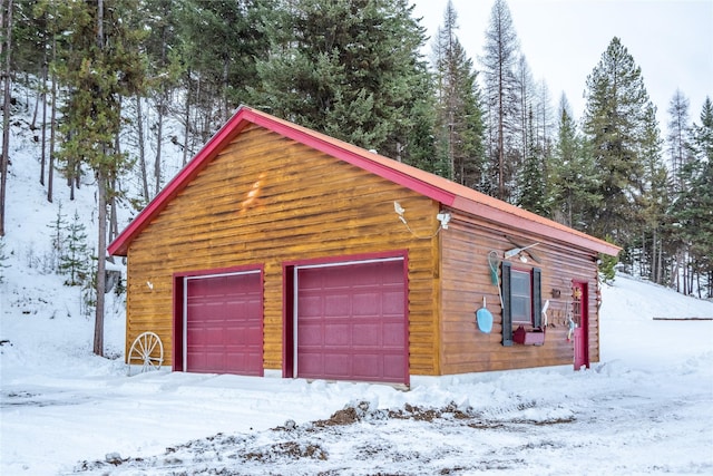 view of snow covered garage