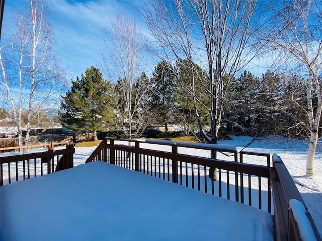 view of snow covered deck