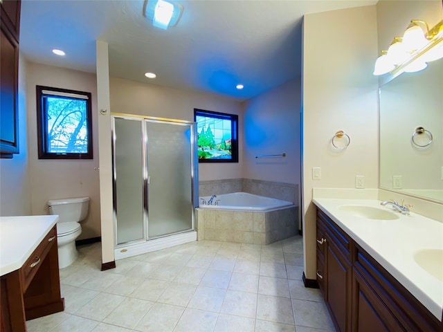 full bathroom featuring tile patterned floors, toilet, vanity, and separate shower and tub