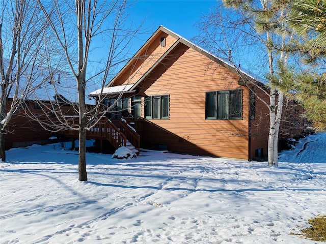 view of snow covered house