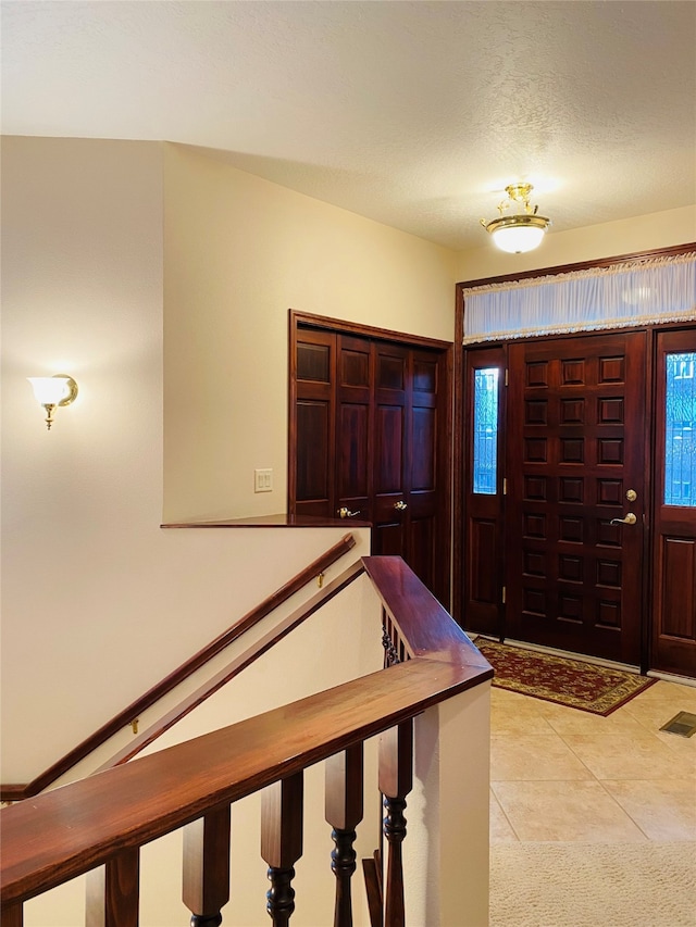 foyer entrance featuring light tile patterned floors