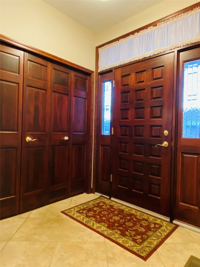 view of tiled foyer entrance