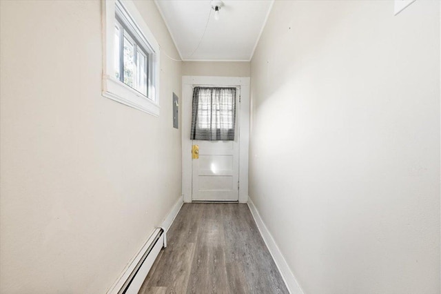 entryway with a baseboard heating unit and hardwood / wood-style floors