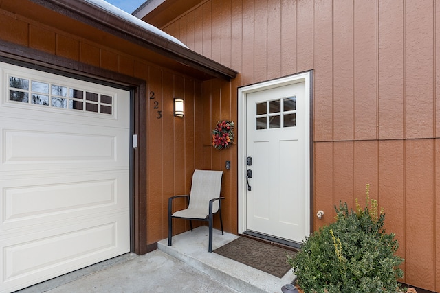 view of exterior entry featuring a garage