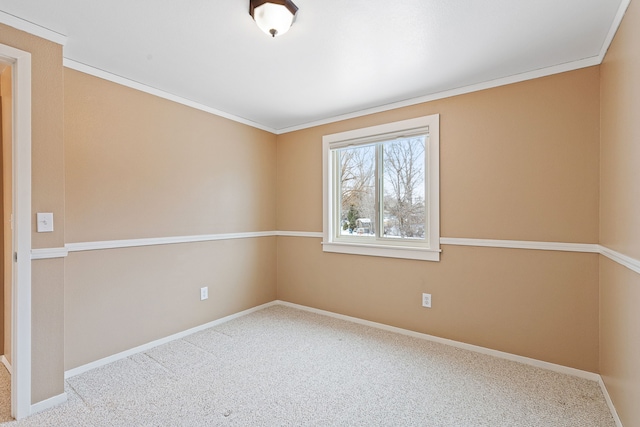 carpeted spare room with ornamental molding