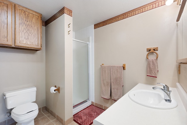 bathroom with sink, toilet, an enclosed shower, and tile patterned floors