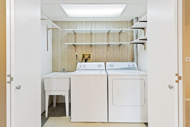 laundry room with washing machine and clothes dryer