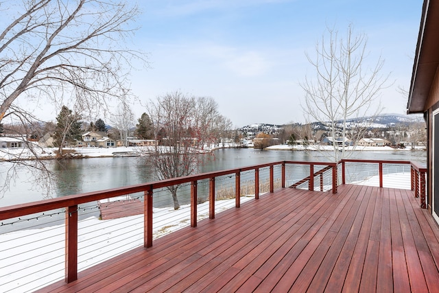 view of dock featuring a deck with water view