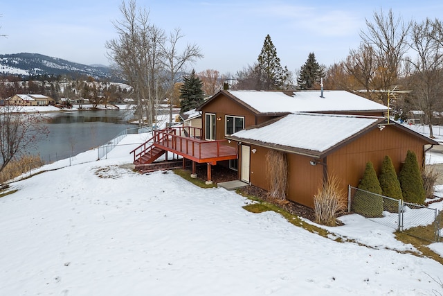 exterior space featuring a deck with mountain view