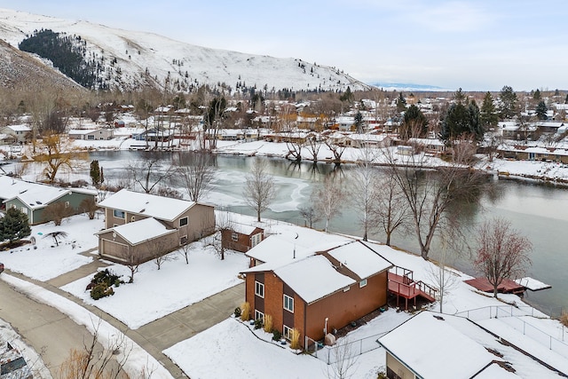 snowy aerial view with a mountain view